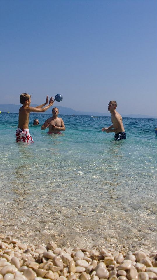 Boys playing. I wanted to capture a shot that would contain everything from the gravel to the sky. The whole place was crystal clear, and so is the shot. Not busy, but simple instead.