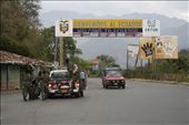 Fig 1.  7 am, on the Ecuadorian side of the Peru/Ecuador border. What initially came to mind when I heard the harsh crack.. crack… crack-crack-crack was fireworks being set-off, as earlier I had seen some children playing in the street, I then realised it was the sound of AK47's ricocheting though the foliage in the jungle  to my left. Shortly after, soldiers dressed in camouflage and balaclavas appeared out of the dense thicket, yelling and carrying two men and what looked to be large plastic containers. They were all hurried into a utility vehicle that sped off as quickly as it had screeched up. I was later told that these masked individuals were government forces that had captured Peruvian diesel smugglers; many of which drown each year trying to swim containers of diesel across the nearby river border. This was to be the beginning of my 6-month stay in one of the most diverse and touching countries I have seen, WELCOME TO ECUADOR!: by aartfielder, Views[419]