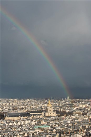 Part way up the Eiffel Tower and a rainbow across Paris