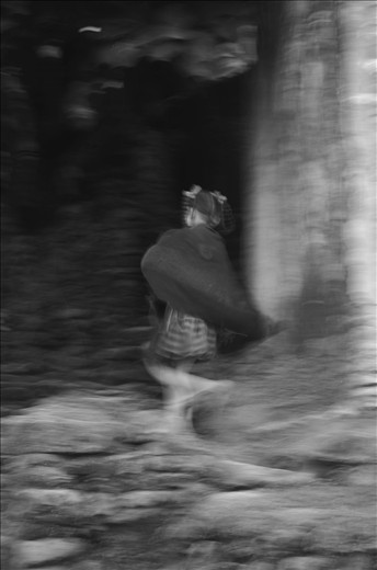 Young girl running through the village
