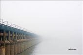 This place is called krishna river in vijayawada. Its 300kms frm my place. Was on travel to temple. 
Early in the morning around 6am its all covered by fog and not seen properly. The white part what you can actually see is the extension of the bridge on left. I framed the fisher man on the right and having a background of pale color wid the dark visible thing on my left.: by abhinavkodam, Views[818]