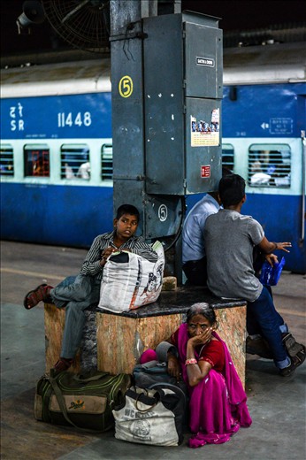 A feisty little kid with his grandmother going back to their home town to celebrate a traditional village festival. He was running all around the place but always tended to his almost blind grandmother. 