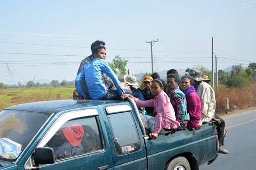 Transportation of over dozen Cambodian workers in a pick-up vehicle.