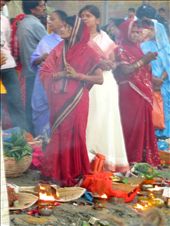 A woman prays amongst offerings of candles, incense, and flowers. Tomorrow, the entire ritual will be repeated.: by acbauer, Views[318]