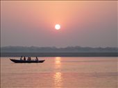 It is sunrise on the banks of the Ganges River in Varanasi, India. Rays of light push through the hot, heavy fog as people make their way to the sacred river for morning prayer. : by acbauer, Views[593]
