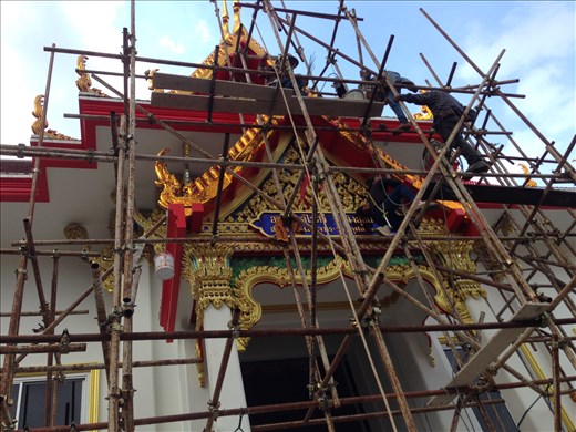 The wisp goes right on the roof's ridge peak