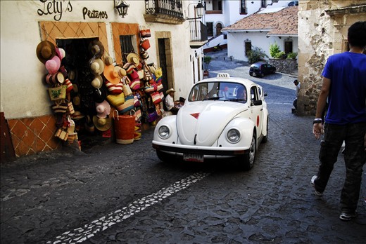 Artisans and Lovers. The artisans continue inside to create beautiful colourful work. Outside there is a clash of ages. Vintage and modern come together, cowboys and urban cowboys. 