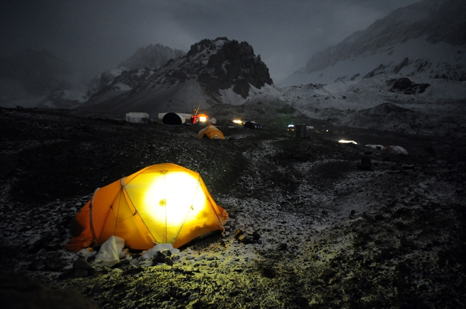 Night and snow fall on the Plaza Argentina basecamp of Mt. Aconcagua where mounatineers acclimatize themselves prior to moving up to the higher camps.