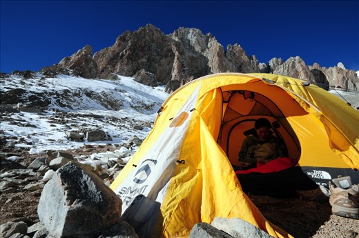A mountaineer rests at the first of three high camps en route to the summit of Mt. Aconcagua.
