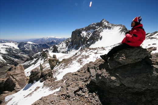 A mountaineer relishes the view at the second of three high camps en route to the summit of Mt. Aconcagua.
