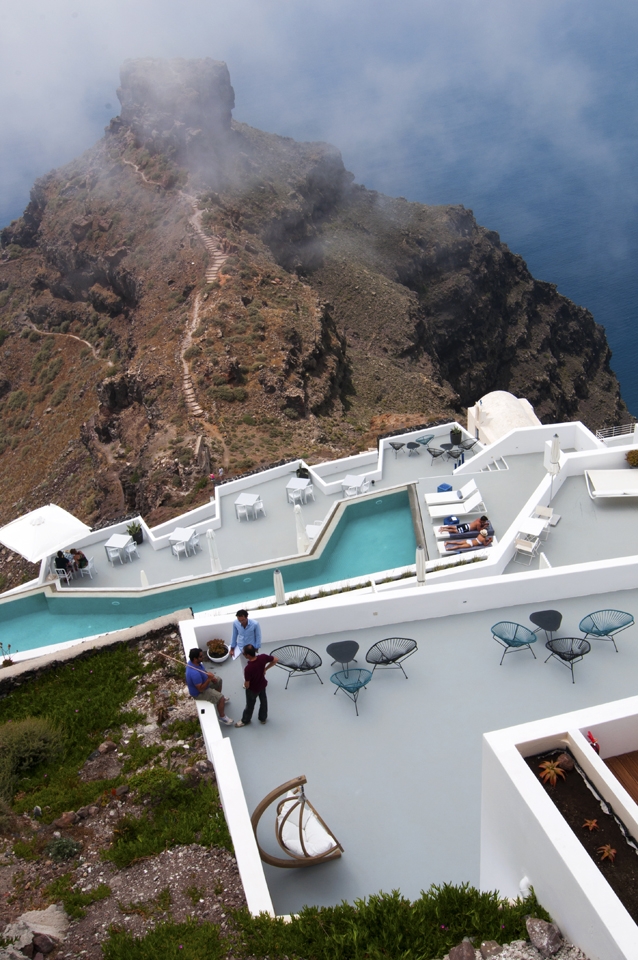 View over Hotel, Caldera Cliff and Mountain in Imerovigli, Santorini, Greece.