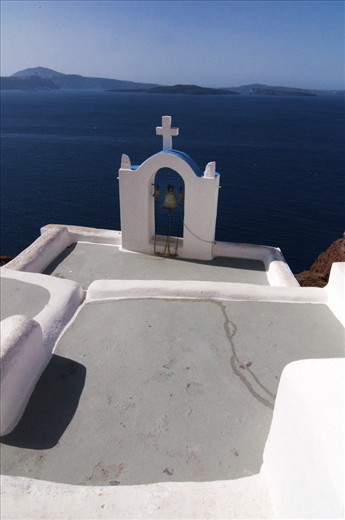 A small Belltower in Oia overlooking Santorini's Caldera, Greece.