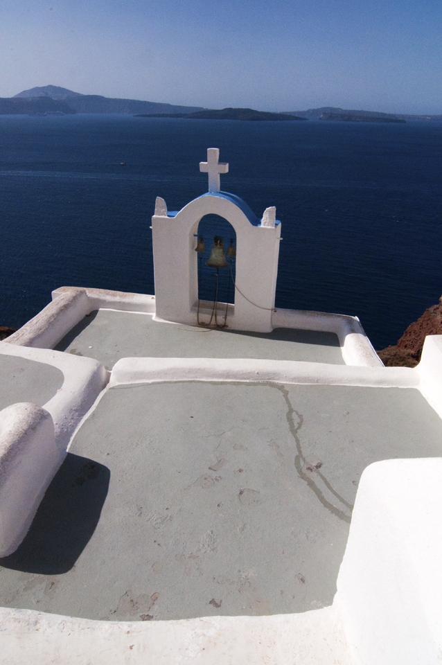 A small Belltower in Oia overlooking Santorini's Caldera, Greece.