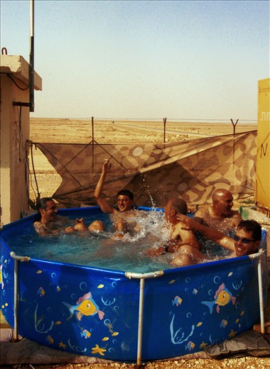 Back at the base its time to relax, and get ready to head home after a month of patrols in the field. This time has been like a vacation from the daily lives of the reservists who come from all over the country. Here truck drivers and lawyers, plumbers and bank managers are equal, if only for a moment. 