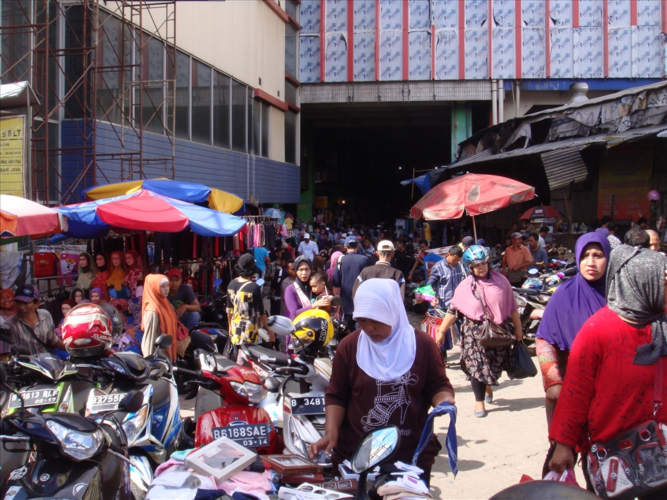 Now we've been in the Tanah Abang Market, very crowded. 
and so many people who are shopping for their needs.