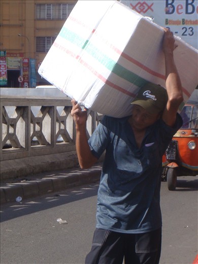 one of the porters carrying goods in the Tanah Abang market.
they work as porters with wages so small,
they usually carry heavy goods purchased by the buyer.
and they are also part of the Tanah Abang market. and their services are needed.