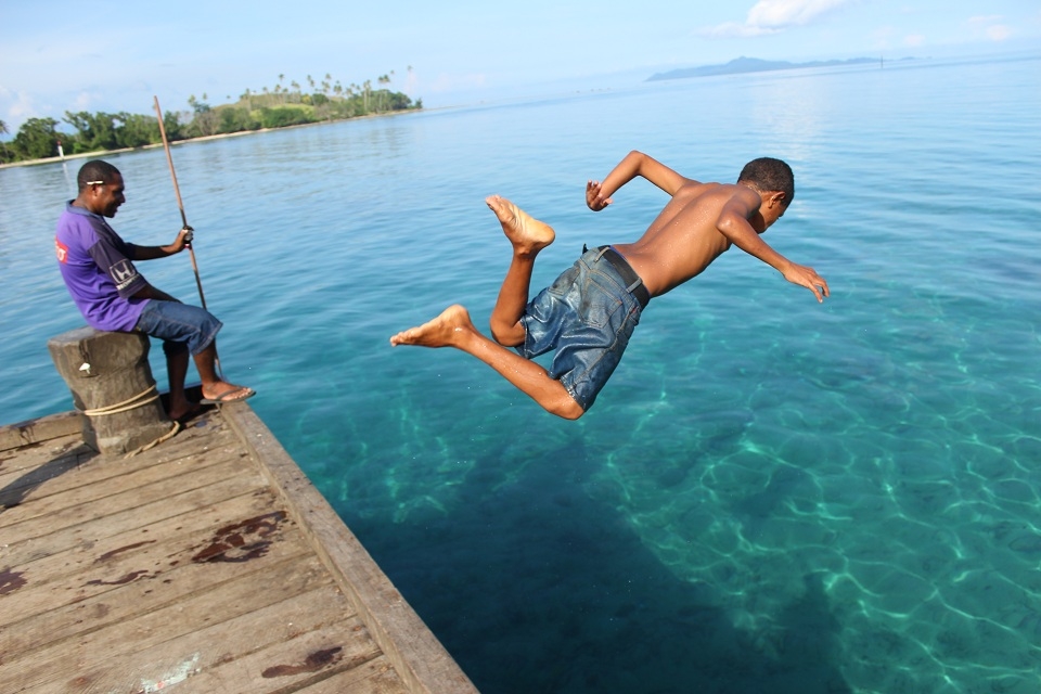   A young boy plunged into the pristine water off East Cape to escape the heat,