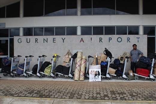 A lone passenger waiting for the flight to Port Moresby at Alotau Gurney Airport