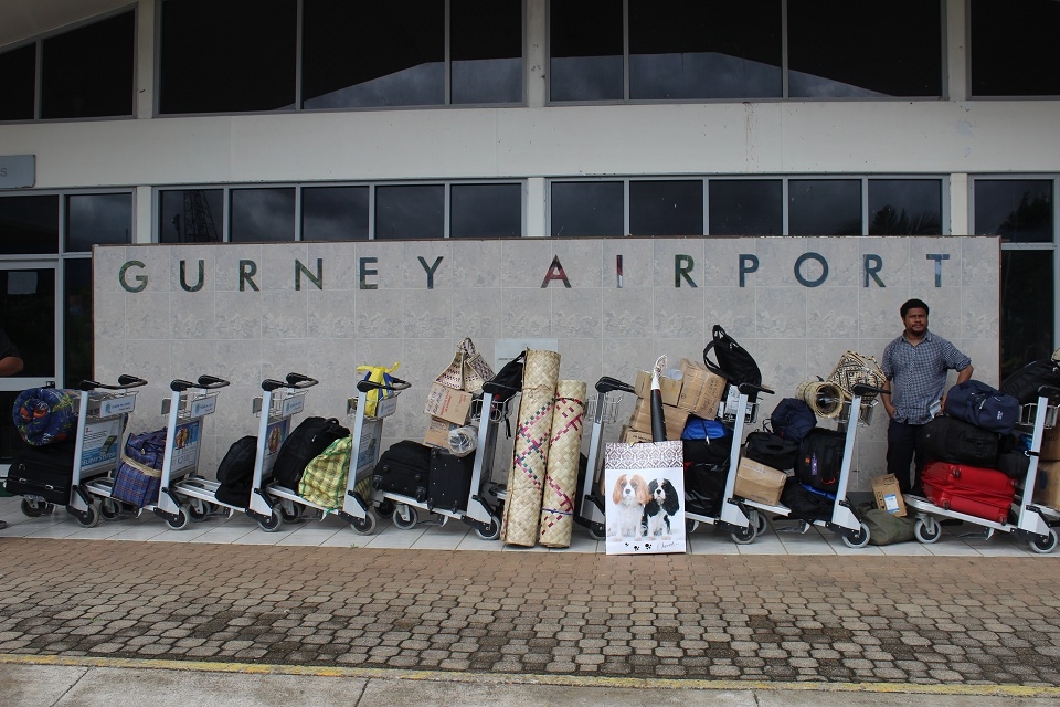 A lone passenger waiting for the flight to Port Moresby at Alotau Gurney Airport