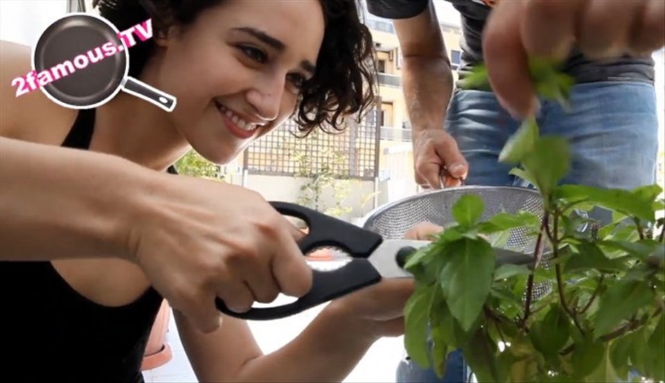 Adrian cutting fresh basil before we make breakfast