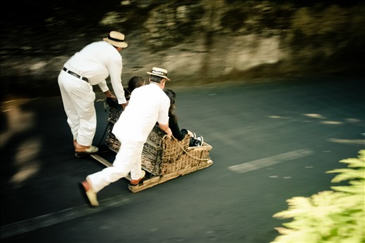 Madeira is very famous for its toboggan sledges. These basket rides are a old mean of quick transportation from the tops to Funchal. Today it is only touristic, but it still taks people at a bold 50km/h through the narrow mountainy roads to the capital center.
