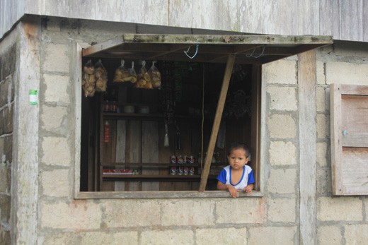 Your store of choice. This young sales boy is busy watching the store and if som