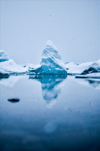 A small iceberg floats through Jökulsárlón, an glacial lagoon in SW Iceland.