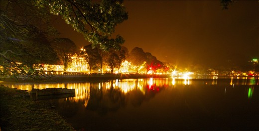 Night view of Kandy Lake. If you follow the white hand rail along the waters edg