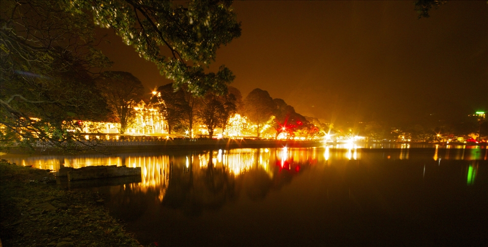 Night view of Kandy Lake. If you follow the white hand rail along the waters edg