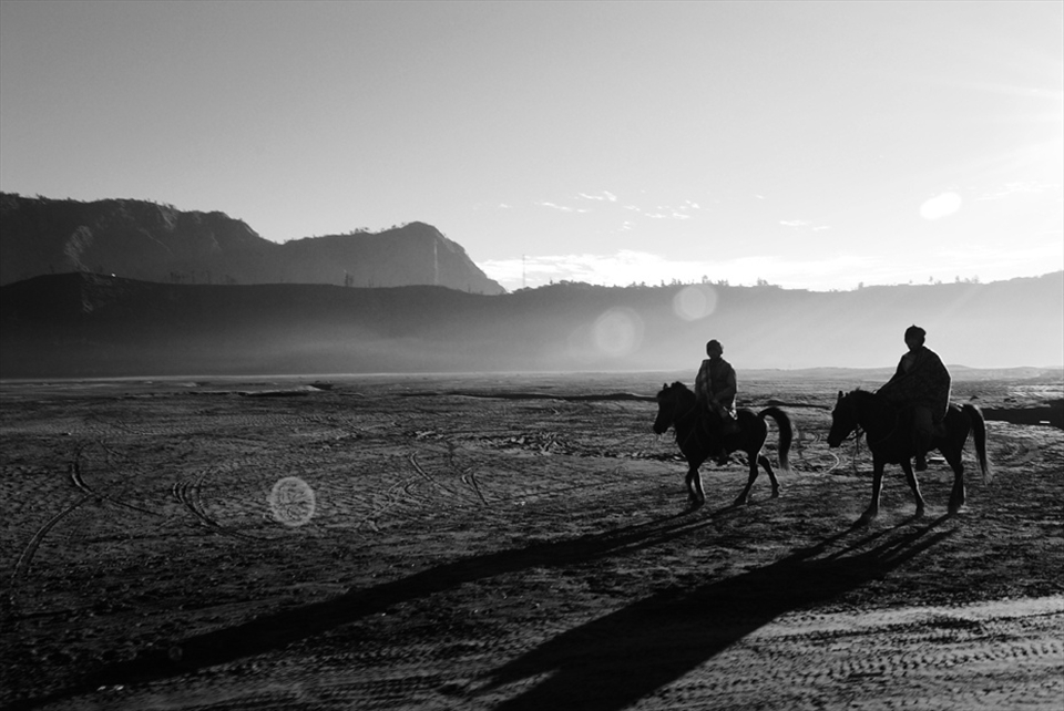 Men from Tengger Tribe trying to rent their horses to the visitors.