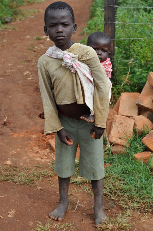 Sibling caregiver's traditionally been assigned to girls,but more boys're taking on the role.This shift in task distribution's new positive phenomenon.It's role helping boys build children and family understanding,and become better father and family head.In the photo,9-year old James's taking care of his sister Grace,one of 7 siblings.They live with their sick mother unable to do household tasks.James assumes the role of a caregiver and head.All this at the expense of his 'normal' childhood...