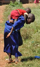 Innocent,8-years old'is caregiver to her younger brother Charles.She, likeher peers,does her best though overwhelmed trying to perfom well in her adult role.Regardless of the burden,these young caregivers never complain or refuse.They take their job seriously and look after their little charges responsibly and lovingly.: by africanadventure, Views[436]