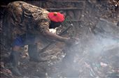 Burning and digging in trash provides a chance to find clothes and other stuff.: by africanadventure, Views[605]