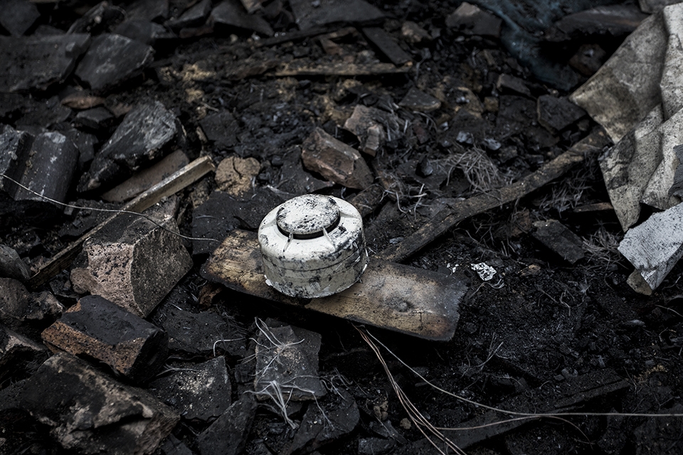 Part of the fire warning system undamaged despite the destruction all around it.