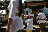 Numerous festivities are held throughout the year involving family members of all ages. This shot conveys the hastiness in one of the temples in Kuta on Galungan. Gifts are being laid in traditional fancy costumes wore on that occasion. : by agataanastazya, Views[268]