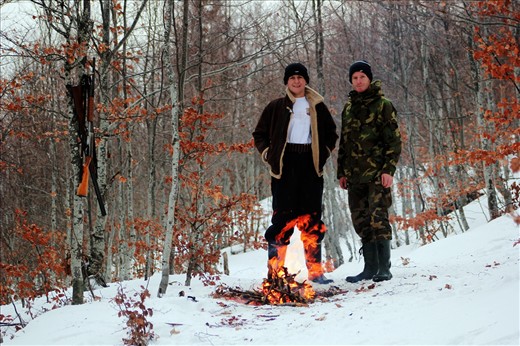 Hunters getting warmed near a fire in this cold hunting day