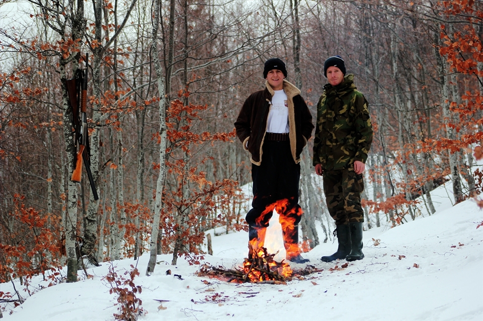 Hunters getting warmed near a fire in this cold hunting day