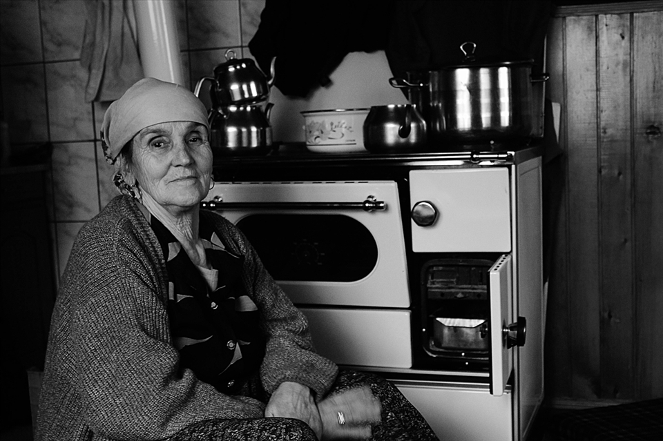 Old mother prepares the dinner for hunters