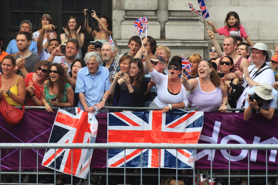 British cheers grow louder as an English athlete is set to cross their path.