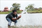 My friend playing with water at Madayi Kavu or Madayi Temple.: by ajax9930, Views[547]