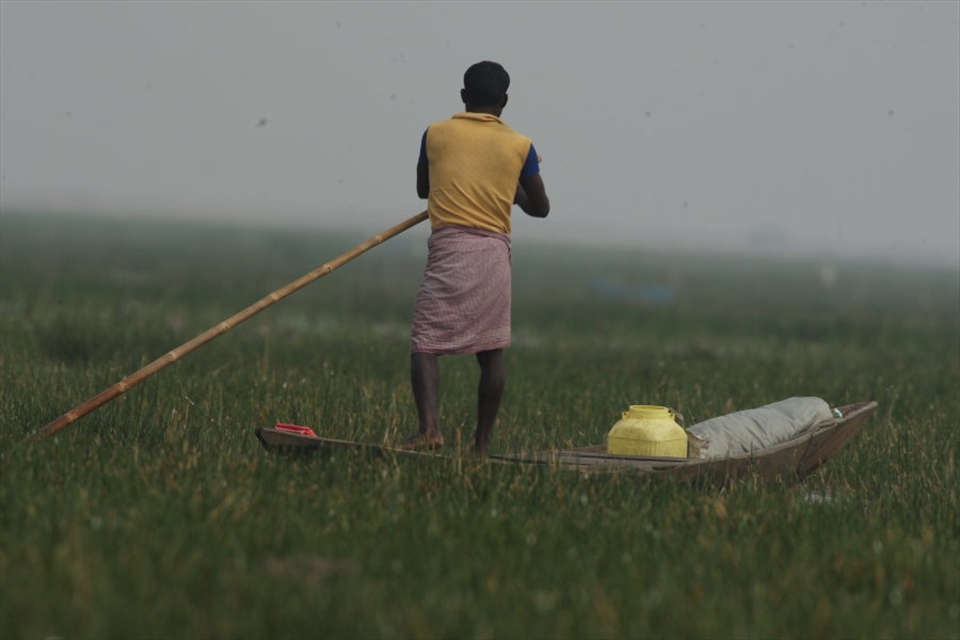 Fishermen of Chilika Lake on their boat homes ferrying fresh water and supplies