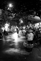 A street merchant wanders the city at night looking for sale. : by akalili, Views[284]