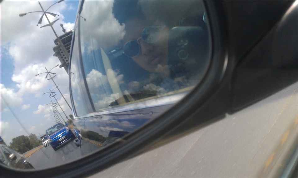 Straight road left behind journeying towards a new place