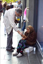 Here's one of the rare momonts when somebody actually gave her some money, I've waited about 2 hours to take this picture, only four people approached her in that time.: by akeyphotographer, Views[276]