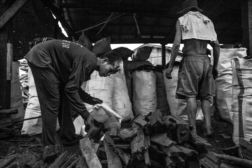 These two workers were in a hurry to finish their job in the packing area. The t