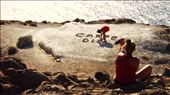 [Is there any life out there? In the sparkling sun of the ocean...] At the southernmost tip of Santorini, I watch two girls arrange rocks into the words 'Carpe Diem'. A couple minutes later and the words would have already been fully formed, but the moment is perfect; I am capturing the action. A girl sits above them, directing their movements, and the sun sparkles down over us, rippling fragments of light bobbing on the ocean's enthusiasm, urging us to seize the day.: by alaskarue, Views[376]
