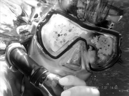 [Under fear and rivulets.]
A self-portrait. Clasping the snorkel against lips, heartbeat thumping in my ears, the ocean uncurls like a lion waking from rest. I am barely under the surface of the underwater sky, staring down thirty feet till the sandy bottoms. I am petrified.