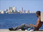 A young Cuban relaxing in Malecon dreaming of a life that  he probably doesn't even want while the time slowly passes by....: by albatros502, Views[706]