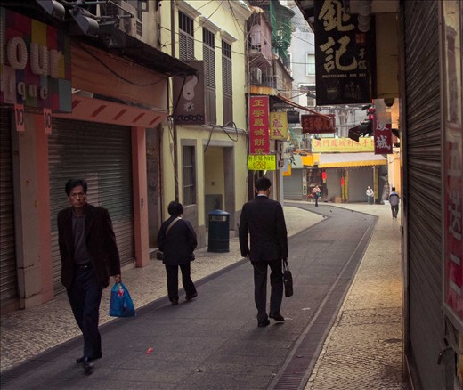 Macau, China - Locals get ready to go to work early in the morning along St Paul's Road in Macau a few days before the start of the New Year of the Gregorian Calendar.