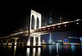 Macau, China - The lights of the Macau Bridge cuts thru the darkness a few hours before the start of the New Year. The Macau Tower can be seen behind it.: by alec_corpuz, Views[323]